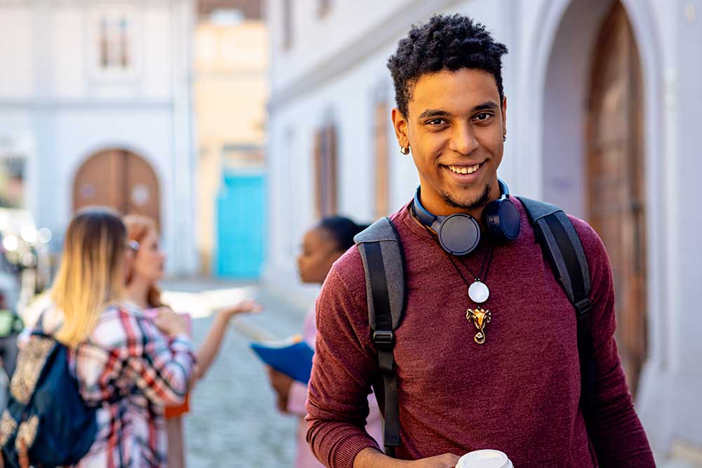 Student outside a university building